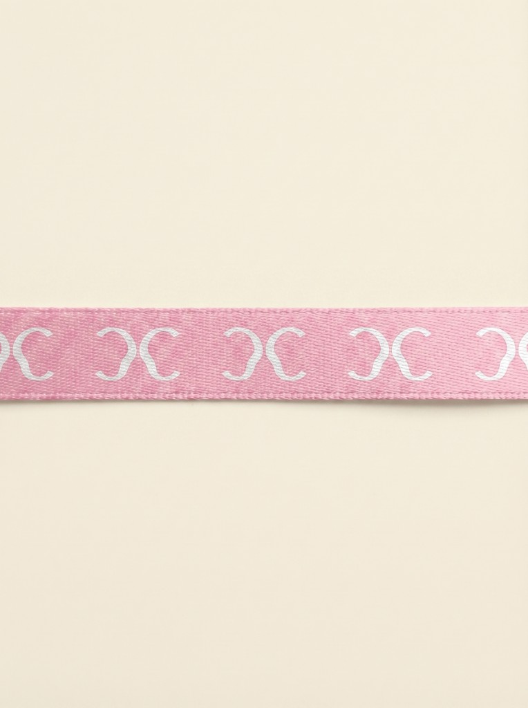 Acco blush ribbon with repeating monogram pattern